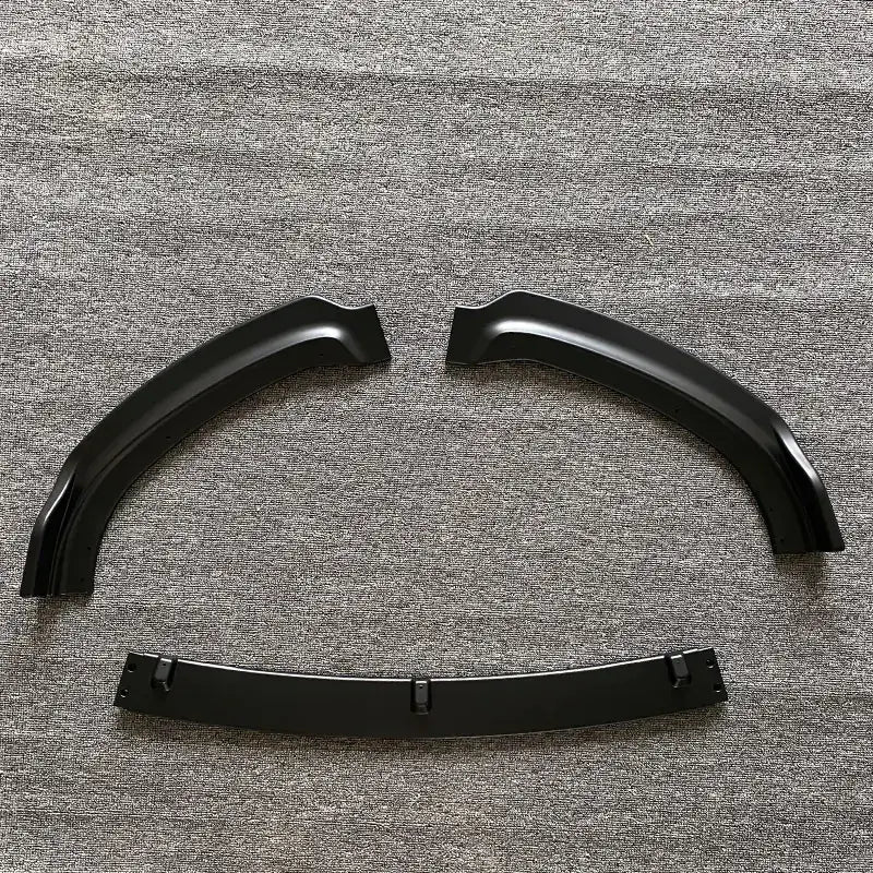 Black plastic fender flares with a glossy finish and integrated mounting brackets.