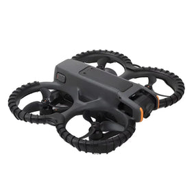 Black and orange quadcopter drone with rugged, textured arms and a compact body.