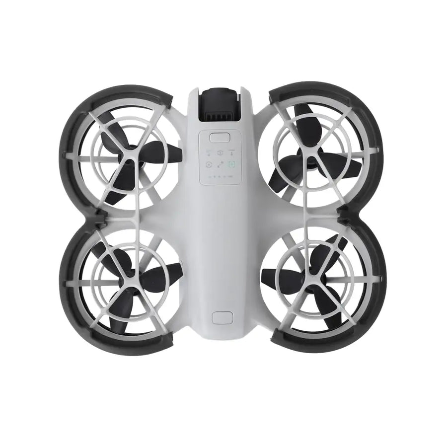White and black quadcopter drone with four propellers, each enclosed in a protective frame.
