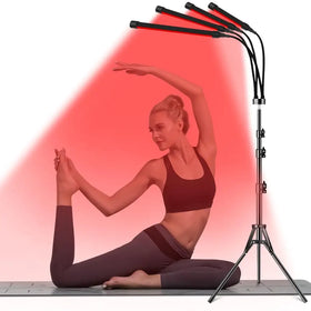 Black tripod-mounted red light therapy lamp with flexible arms and adjustable led panels.