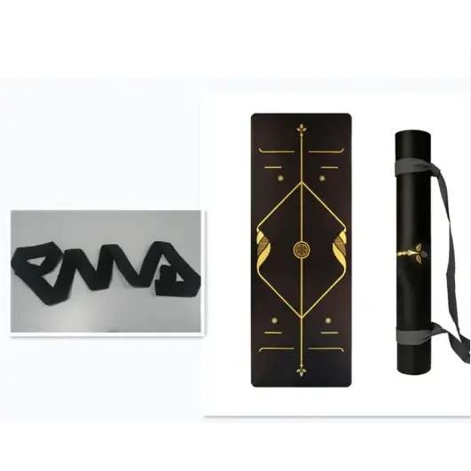 Black yoga mat with gold geometric design and carrying strap