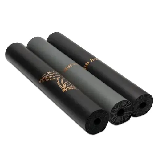 Black yoga mat with gold leaf pattern and brand logo.