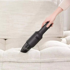 Black handheld vacuum cleaner with a transparent dust collection tip