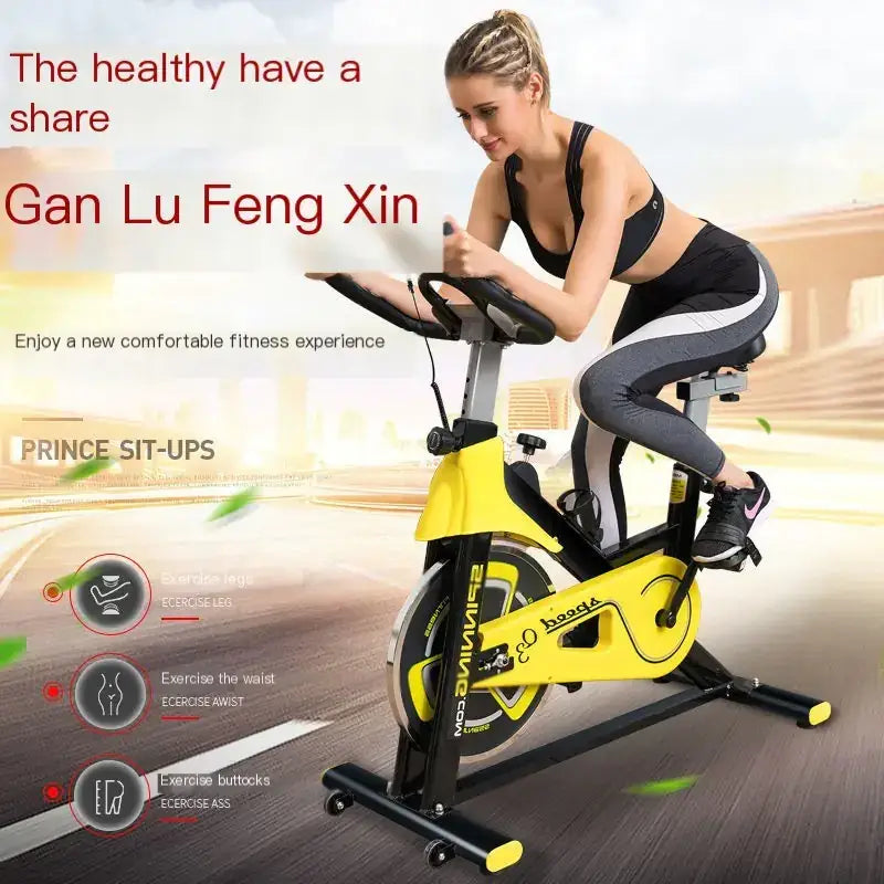 Yellow and black stationary exercise bike with a sleek, modern design.