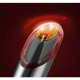 A sleek, transparent red and silver pen with a glowing golden circuit board at its tip.