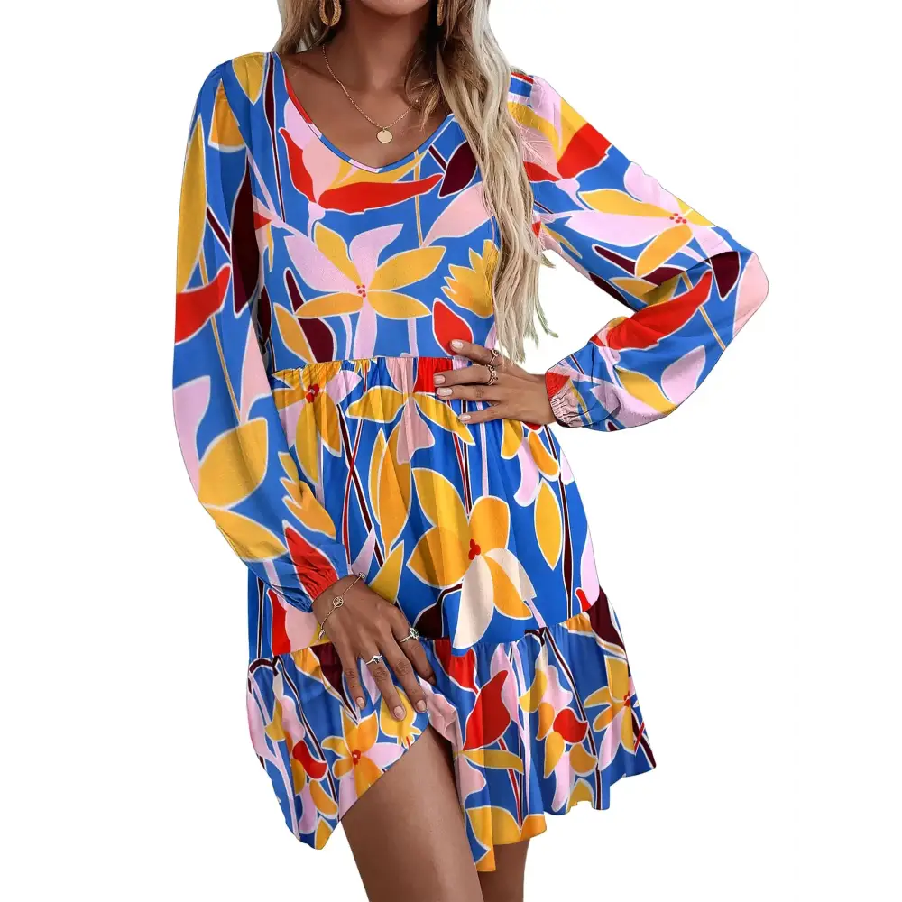 Vibrant blue floral print dress with long sleeves and a ruffled hem.