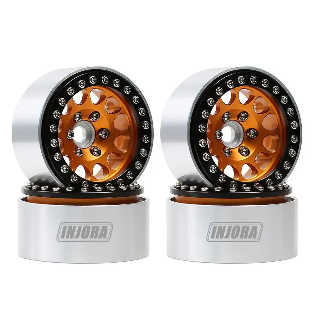 Orange and silver rc car wheels with black accents, featuring a detailed spoke design.