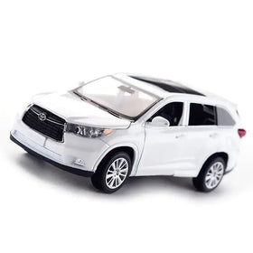 White die-cast toyota highlander suv model toy with black grille and roof, silver alloy wheels.