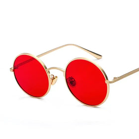 Gold-toned round sunglasses with vibrant red lenses.