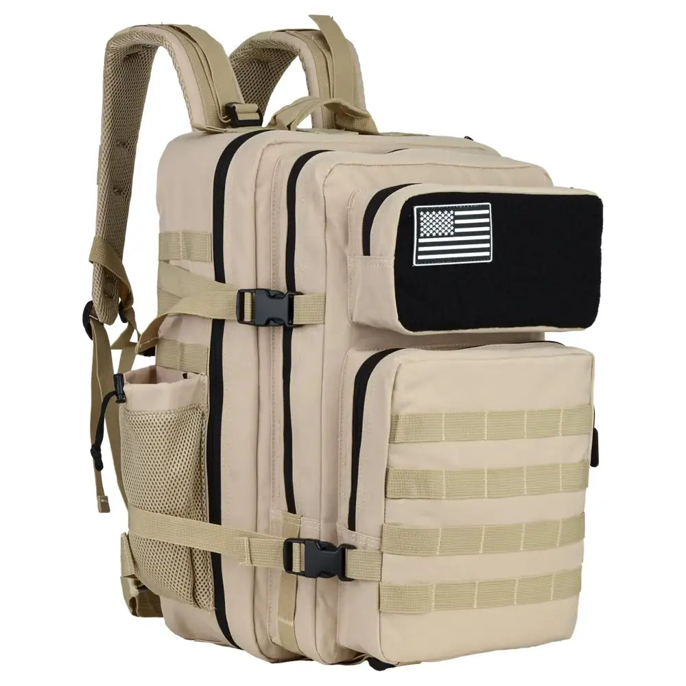 Tan tactical backpack with black trim, webbing straps, and a black patch featuring an american flag emblem.