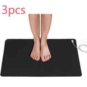 Black rectangular electric heating mat with white power cord and plug