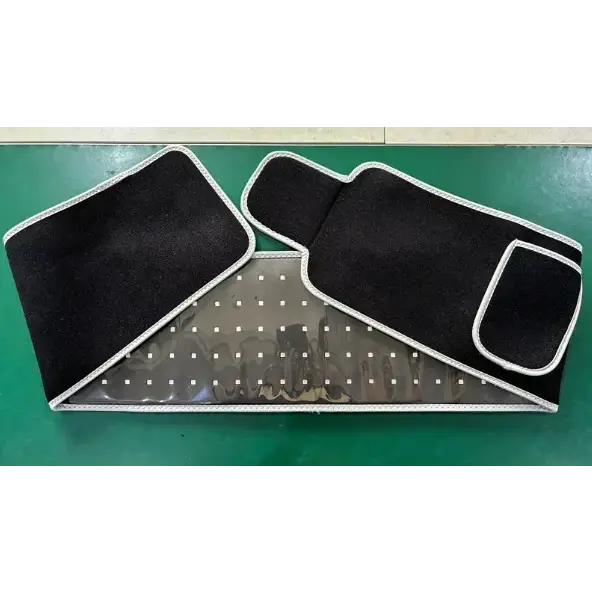 Black elastic waist support belt with white stitched trim and a transparent mesh panel featuring evenly spaced perforations.