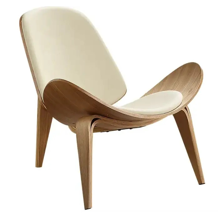Cream-colored upholstered lounge chair with a sleek, curved wooden frame and tapered legs.
