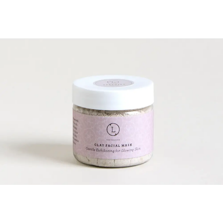 A lavender-labeled jar of clay facial mask with a white lid, containing a light gray exfoliating powder.