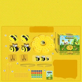 Yellow plastic bee-themed toy set with black stripes and white wings, featuring a honeycomb-shaped centerpiece.