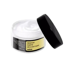White jar with black lid containing a creamy white substance, labeled ’advanced snail 92 all in one cream’ by the brand ouhoo.