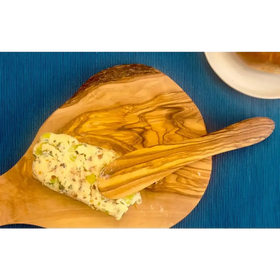 A rustic olive wood cutting board with a natural, swirling grain pattern and a smooth, polished surface.