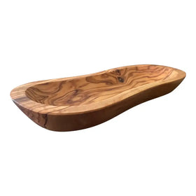 Handcrafted olive wood serving dish with a smooth, natural finish and flowing contours.