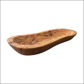 A smooth, elongated olive wood serving dish with a natural grain pattern and rounded edges.