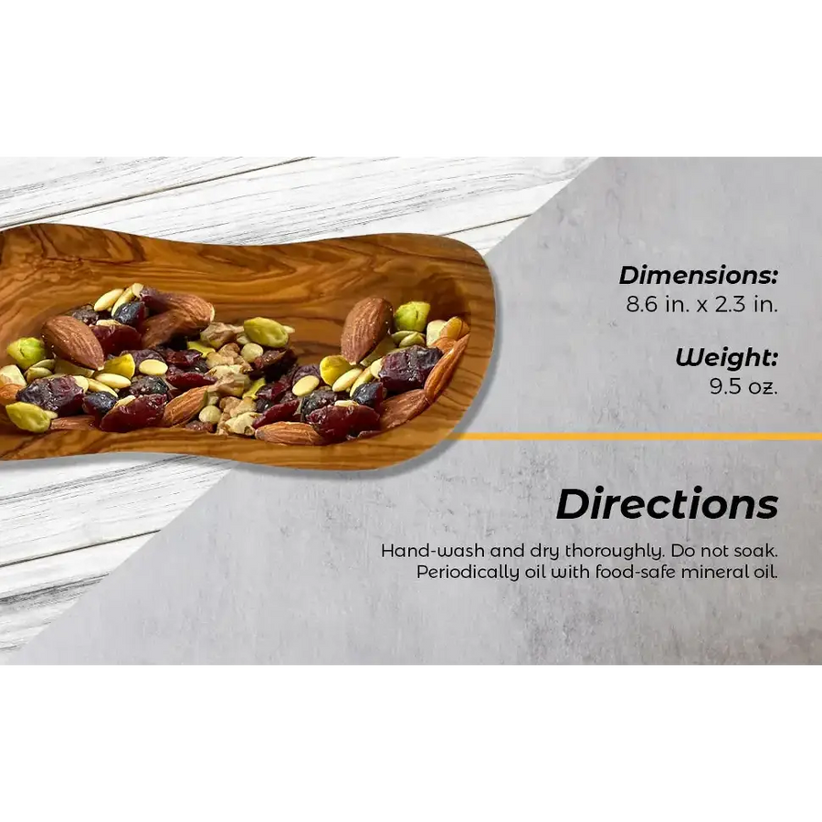 Wooden olive board with a natural, handcrafted finish holding a colorful assortment of mixed nuts and dried fruits.