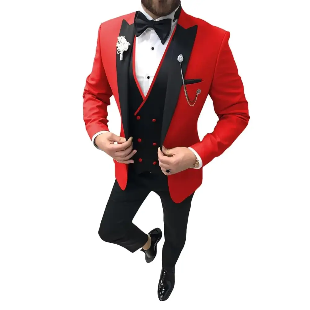 A striking red and black tuxedo jacket with satin lapels, matching vest, and a white dress shirt.