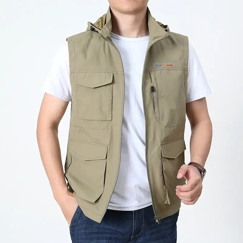 Khaki-colored, multi-pocket outdoor vest with a hood and zipper closure