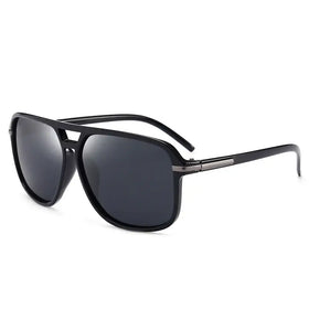 Black aviator sunglasses with dark gray lenses and a sleek, modern design.