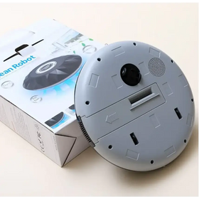 Gray circular robot vacuum cleaner with a black camera lens and speaker grille on its underside.