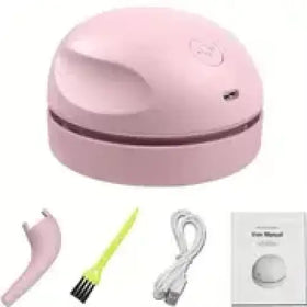 Pink wireless desk vacuum cleaner with detachable brush attachments and charging cable.