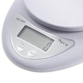White digital kitchen scale with a sleek, rounded design and a clear lcd display showing weight measurements.