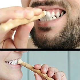 Natural wooden toothpick with a smooth, light brown finish and slightly tapered end.
