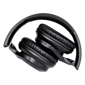 Black over-ear wireless headphones with padded, leather-like earcups and a sleek plastic headband.