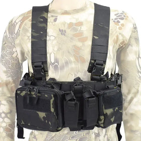 Black and green camouflage tactical chest rig with multiple zippered compartments and adjustable straps.