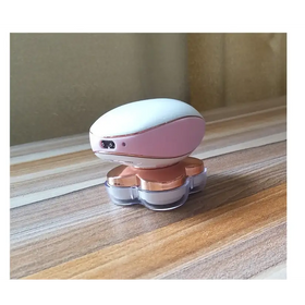 Pink and white electric razor with rose gold accents, featuring a sleek oval handle and four transparent blades.