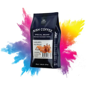 Black nish coffee bag featuring caramel-flavored ground coffee with a glossy finish and colorful splash design.
