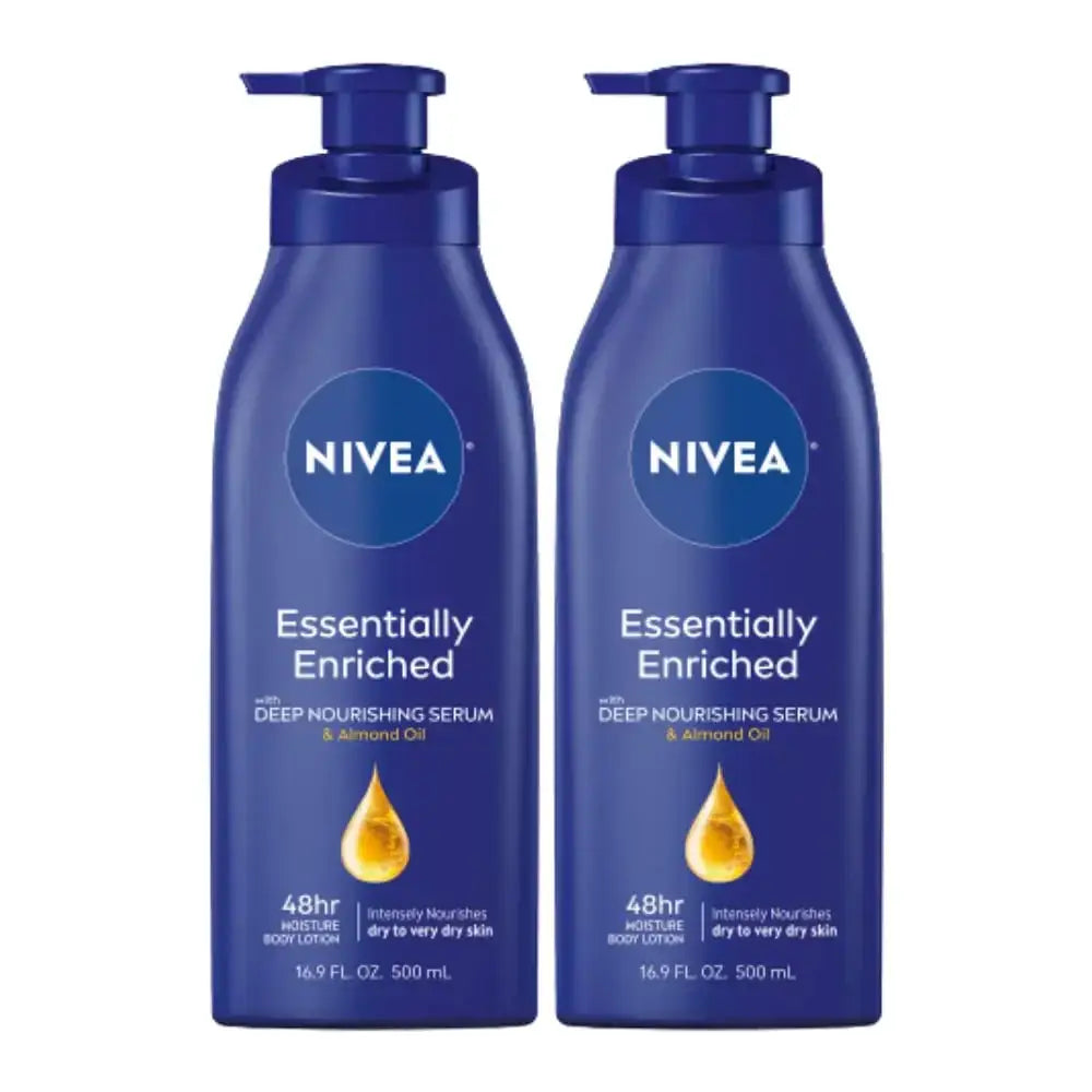 Two identical dark blue nivea essentially enriched body lotions with pump dispensers, each labeled as containing 500 ml of deep nourishing serum and almond oil.