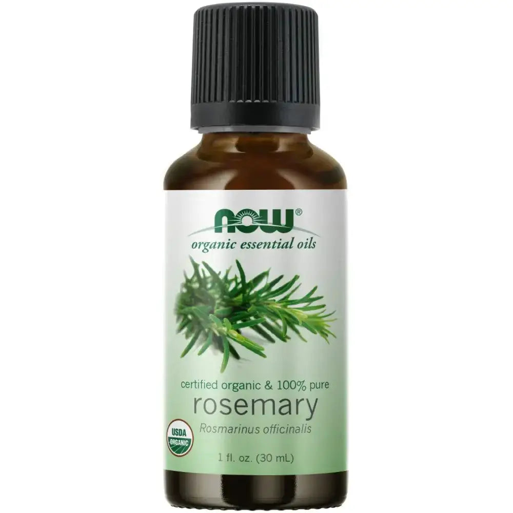 A brown glass bottle with a black ribbed cap and a white label featuring green text, an image of rosemary sprigs, and the ’now’ brand logo.
