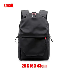 Black nylon backpack with red zipper pulls and black drawstrings.