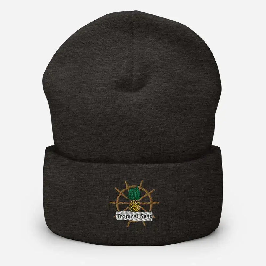 Dark heather gray cuffed knit beanie featuring an embroidered pineapple with a ship’s wheel and ’tropical seas’ banner.
