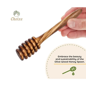 Handcrafted olive wood honey spoon with a natural, warm brown finish and distinctive swirling grain pattern.