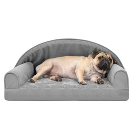 Gray plush dog bed with a soft, cushioned design and rounded armrests.