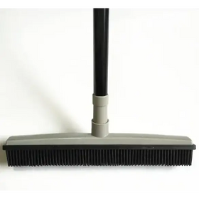 Black and gray floor brush with a long handle, featuring dense bristles for effective cleaning.