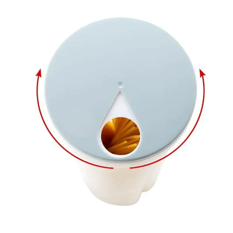 Light blue circular lid with a teardrop-shaped opening revealing golden pasta inside.