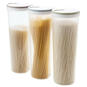 Three transparent cylindrical pasta storage containers with white lids, each holding different types of dried noodles.