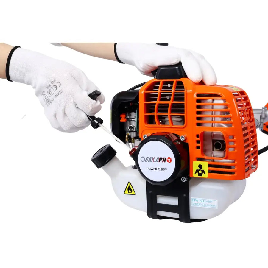Orange and white osakapro 2.2kw gasoline-powered brush cutter engine with black accents and a protective grille.