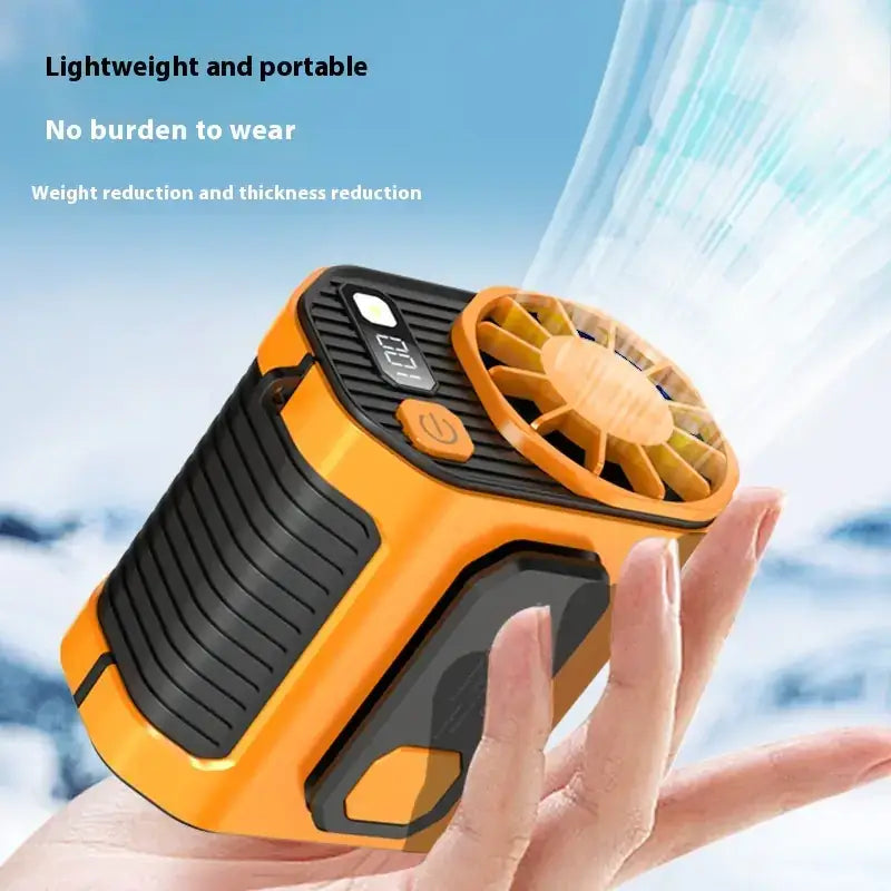Orange and black portable personal cooling fan with a compact, rugged design.