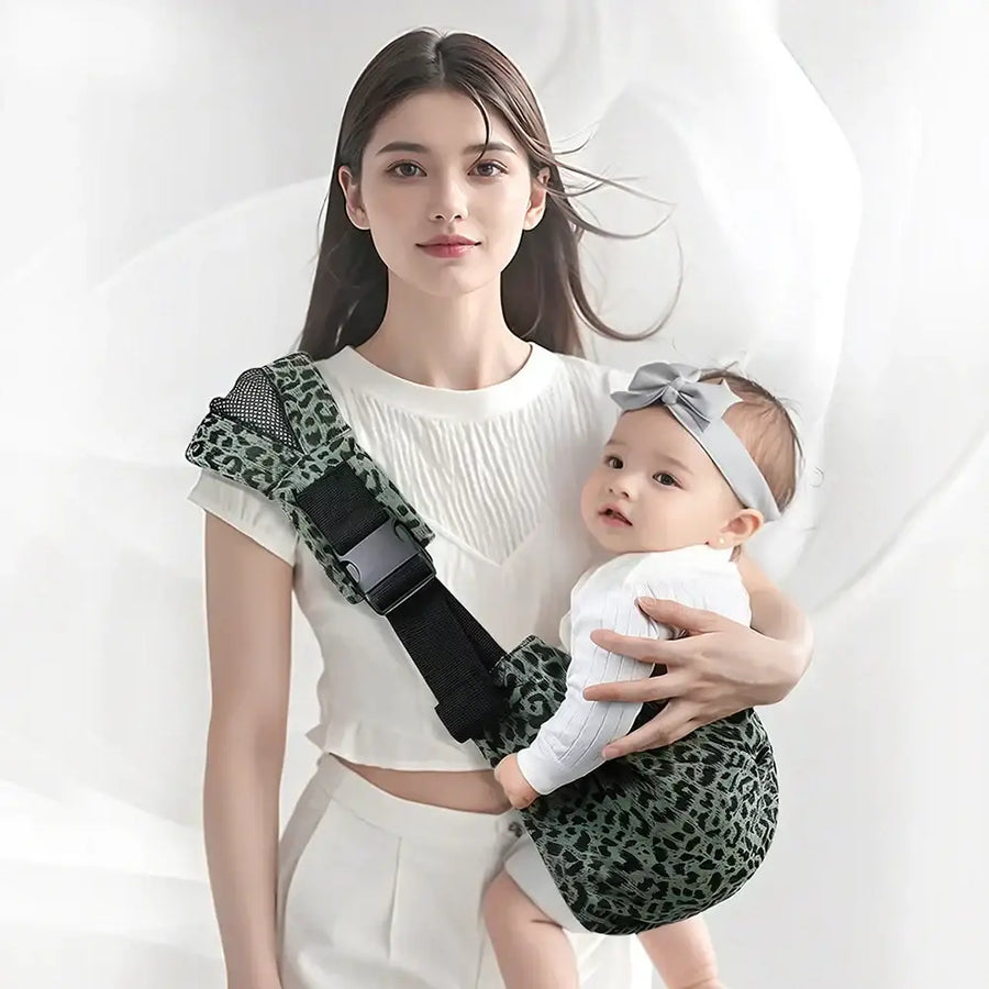 Green leopard-print baby carrier with black adjustable straps and a mesh panel.