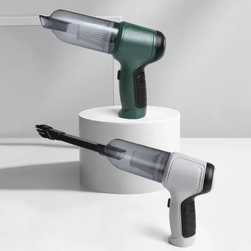 Green and gray handheld vacuum cleaner with a transparent dust collection chamber.