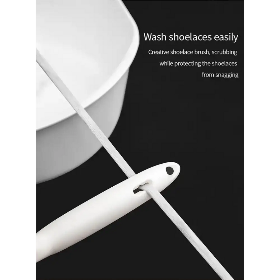 White plastic shoelace brush with a sleek, ergonomic handle and dual bristle heads for gentle scrubbing.