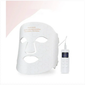 White honeycomb-patterned face mask with matching portable control unit.